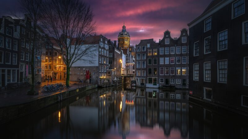Amsterdam Canal Glowing at Twilight wallpaper 4K