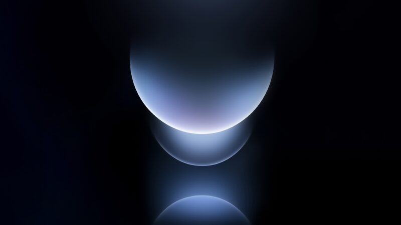 Blue Spheres Floating in Darkness wallpaper 4K
