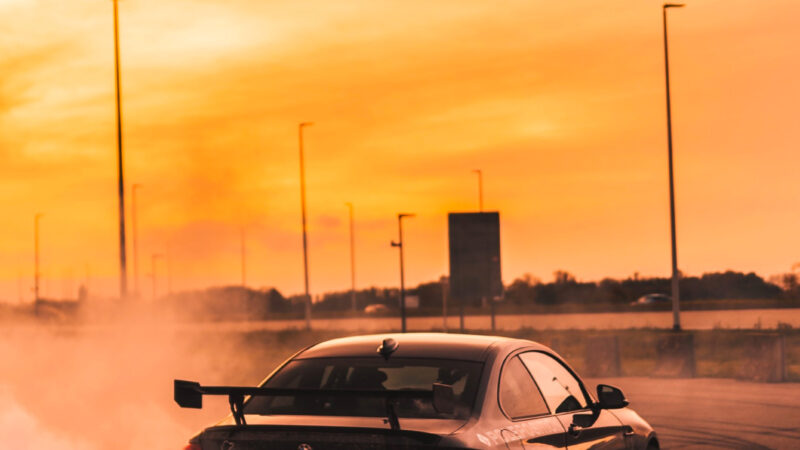 BMW M2 Drift iPhone | Orange Asphalt Smoke wallpaper 4K