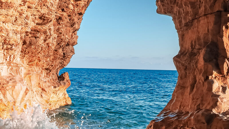 Coastal Cave View iPhone | Ocean Blue & Sunlight wallpaper 4K