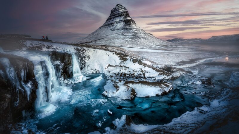 Frozen Kirkjufell Framed by Cascading Falls wallpaper 4K