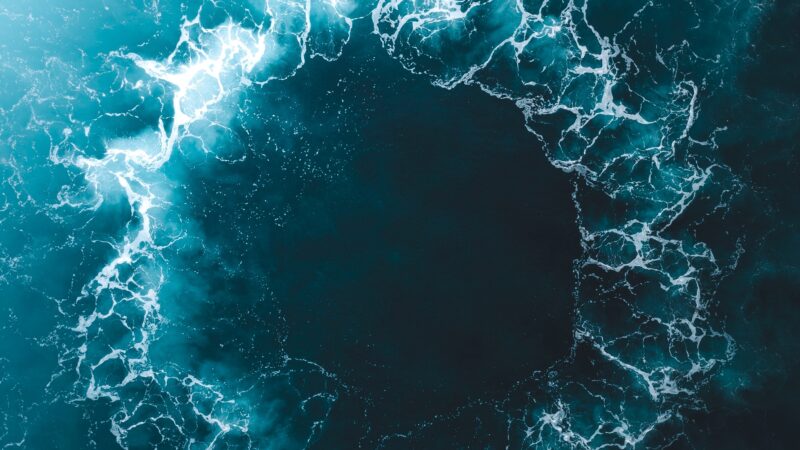 Glowing Ocean Whirlpool Dark Void iPhone Wallpaper 4K wallpaper 4K