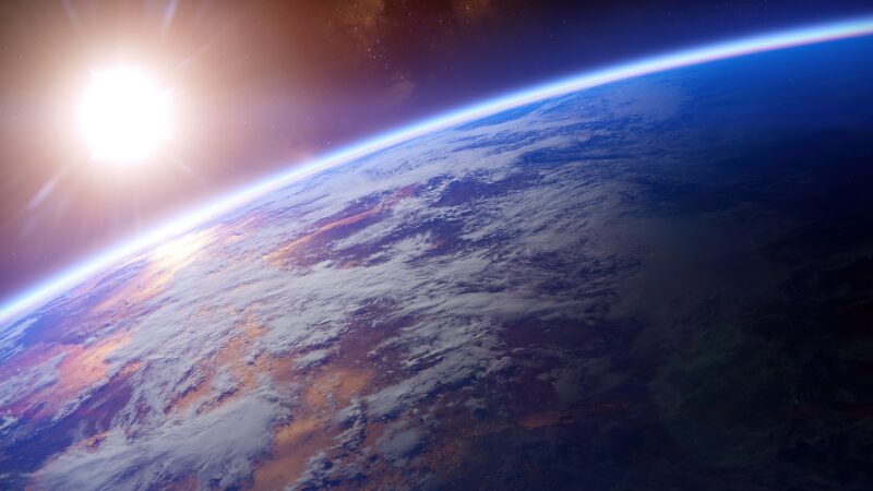 Orbital Earth Glowing Beneath The Sun wallpaper 4K
