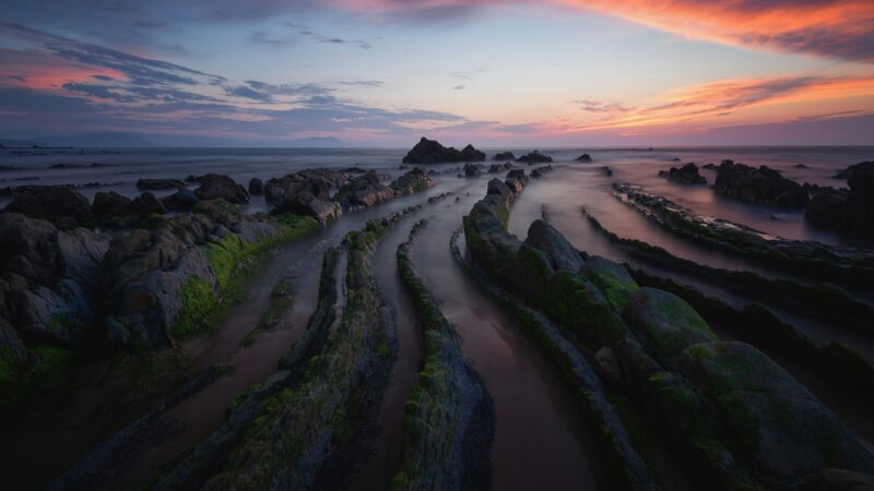 Rocky Barrika Beach Bathed in Sunset wallpaper 4K