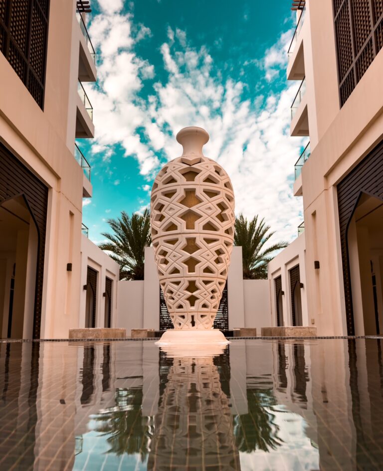 Sculpture Courtyard Reflection | Artistic Pool View iPhone wallpaper 4K