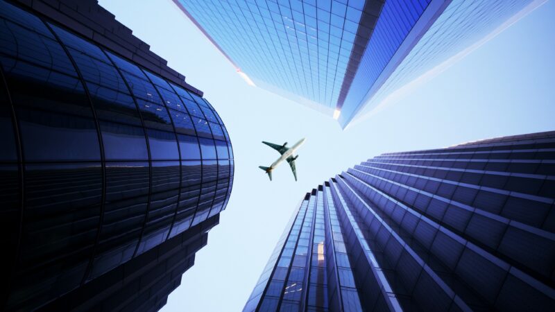 Skyscrapers & Airplane | Modern City View Desktop wallpaper 4K
